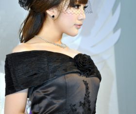 Girl wearing black evening gown wearing veil Stock Photo