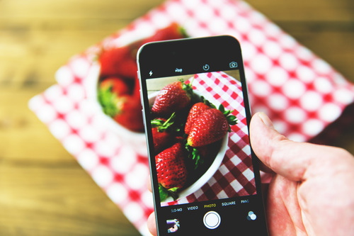 Iphone capturing fruit photo Stock Photo