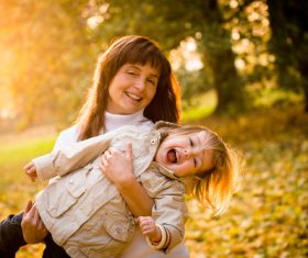 Little child and grandmother playing in the park Stock Photo