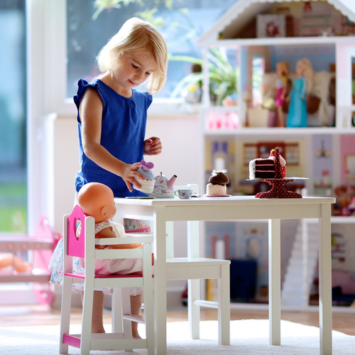 Little girl playing mini doll house at home Stock Photo 03