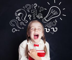 Little girl standing in front of the blackboard Stock Photo 02