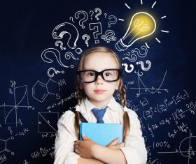 Little girl standing in front of the blackboard Stock Photo 07