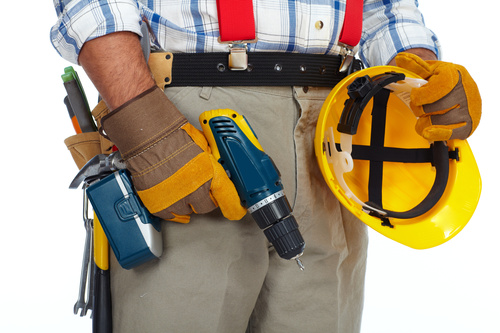 Maintenance worker holding electric drill Stock Photo