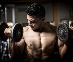 Man doing body building in the gym Stock Photo 02