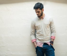 Man leaning against the wall Stock Photo