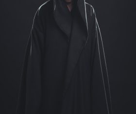 Man wearing black cloak Stock Photo