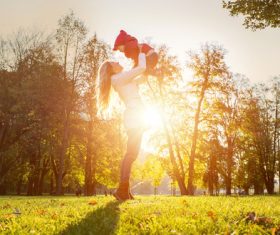 Mother holding child play in the park Stock Photo