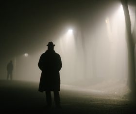 Pedestrians walking on the road at night Stock Photo