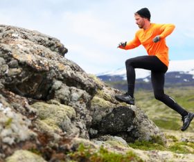 Running mountaineering man Stock Photo