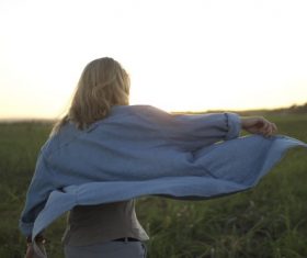 Running woman on the grass Stock Photo