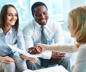 Signing a contract with a customer Stock Photo