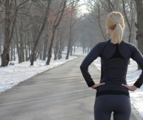 Sports enthusiasts standing outdoors in winter