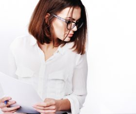 Stock Photo Businesswoman looking at market data files 01