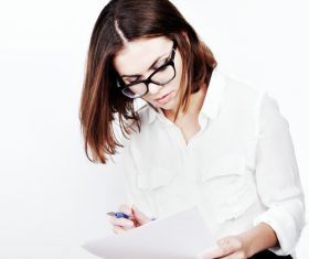 Stock Photo Businesswoman looking at market data files 02