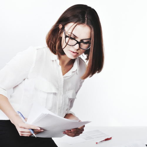 Stock Photo Businesswoman looking at market data files 03