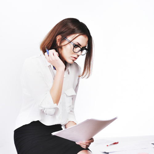 Stock Photo Businesswoman looking at market data files 04