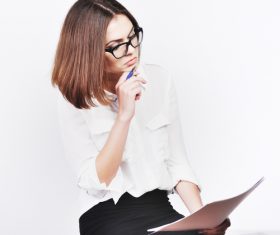 Stock Photo Businesswoman looking at market data files 05