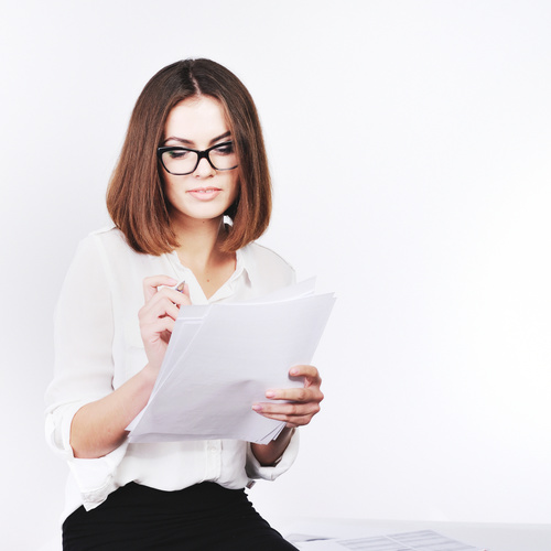 Stock Photo Businesswoman looking at market data files 11