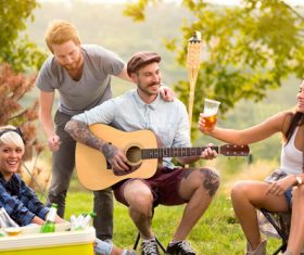 Stock Photo Friends partying man playing guitar 01