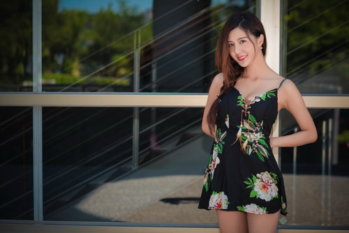 Stock Photo Girl wearing a black floral short skirt