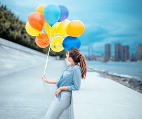 Stock Photo Hand pulled the balloon beauty