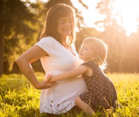 Stock Photo Little girl and grandmother playing in the park