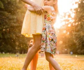 Stock Photo Little girl hugging mother
