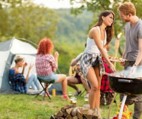 Stock Photo Lovers prepares barbecue for friends at the party 01