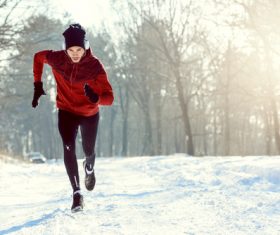 Stock Photo Man running in the snow
