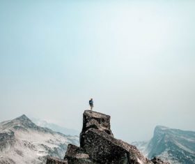 Stock Photo Man standing on the mountain