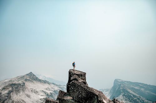 Stock Photo Man standing on the mountain