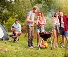 Stock Photo Party friends eating barbecue