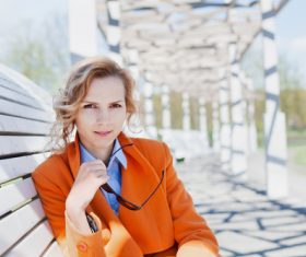 Stock Photo Russian woman sitting on park bench