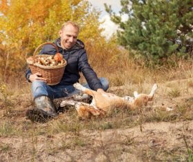 Stock Photo Smiling man and pet dog outdoors