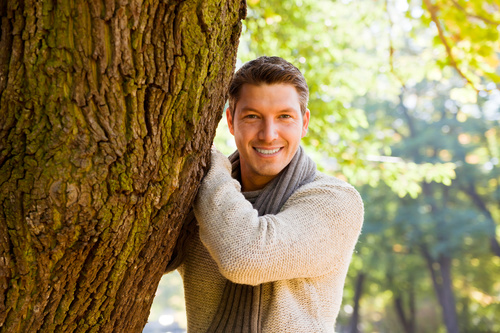 Stock Photo Smiling man and tree