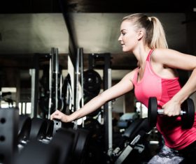 Stock Photo Woman doing body building in gym 01