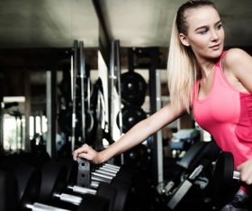 Stock Photo Woman doing body building in gym 02