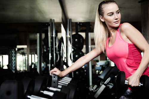 Stock Photo Woman doing body building in gym 02