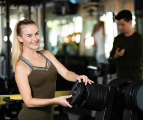 Stock Photo Woman doing body building in gym 05