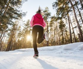 Stock Photo Woman running on the snow