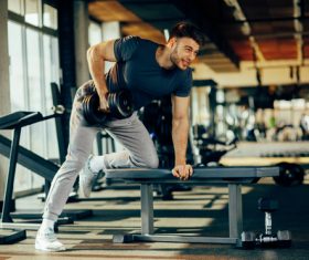 Stock Photo Young male doing biceps exercise with dumbbells 02