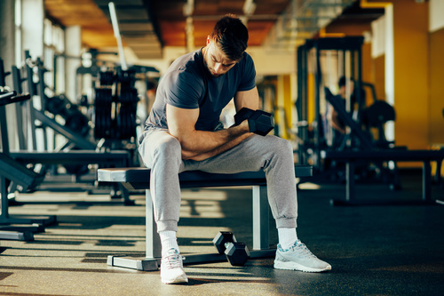 Stock Photo Young male doing biceps exercise with dumbbells 03