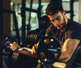 Stock Photo Young male exercising biceps 01