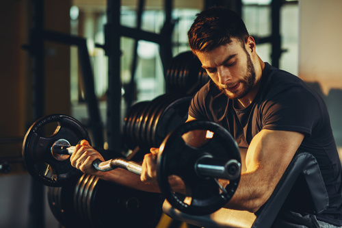 Stock Photo Young male exercising biceps 01