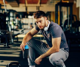 Stock Photo Young male in the gym