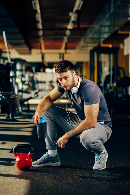 Stock Photo Young male in the gym