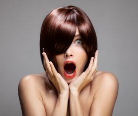 Surprised open mouth red hair woman Stock Photo