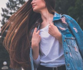 Swinging hair jeans woman Stock Photo