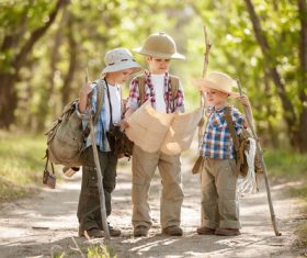 Three tourist children looking at map Stock Photo