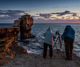 Tripod hunters Stock Photo